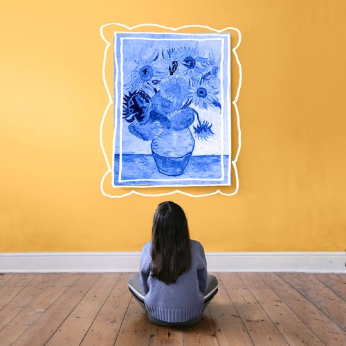 young woman looking at painting