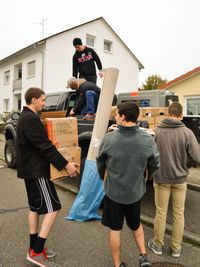 young adults loading a truck