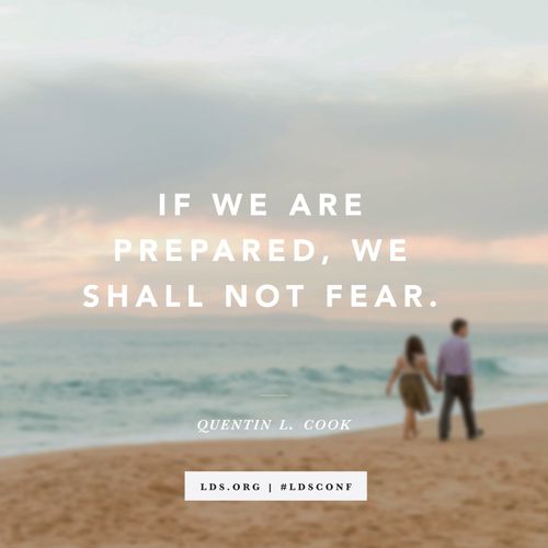 A photograph of a couple holding hands and walking on the beach, with a quote from Elder Quentin L. Cook: “We shall not fear.”