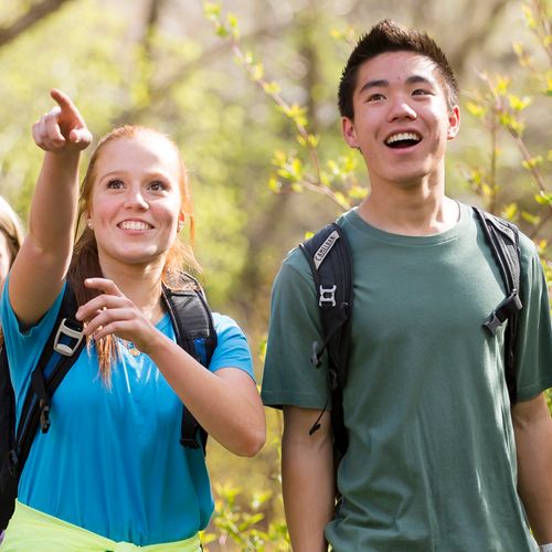 young man and young woman hiking