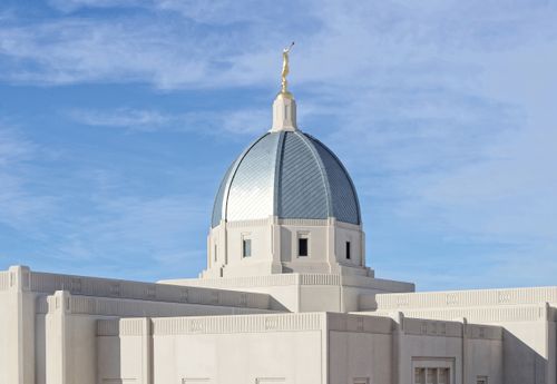 A photograph of the top of the Tucson Arizona Temple against a blue sky.