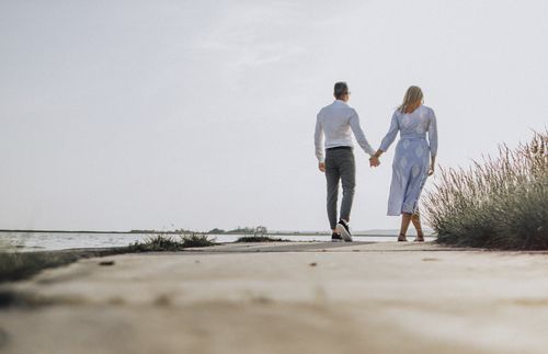 couple walking and holding hands