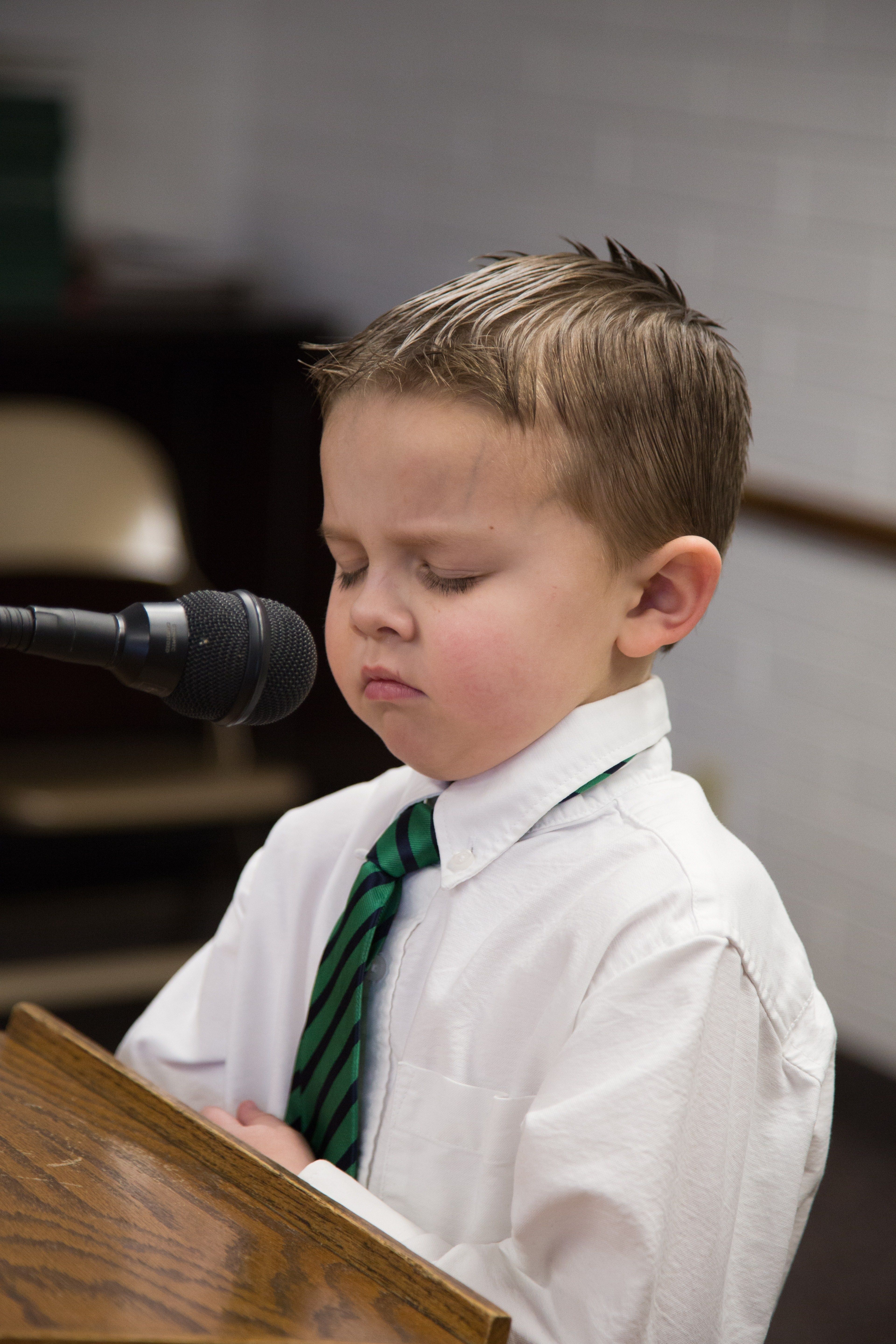 A young boy prays in Primary.