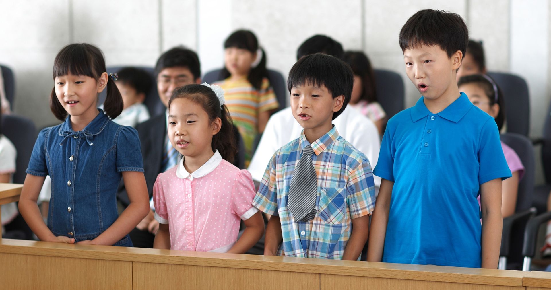 Primary-age children sing