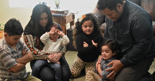 family praying