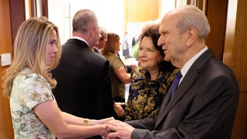President and Sister Nelson talking to a woman