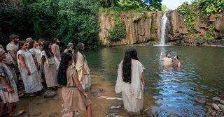 Alma baptizing in the waters of Mormon