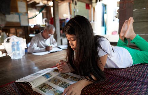 girl looking at a book