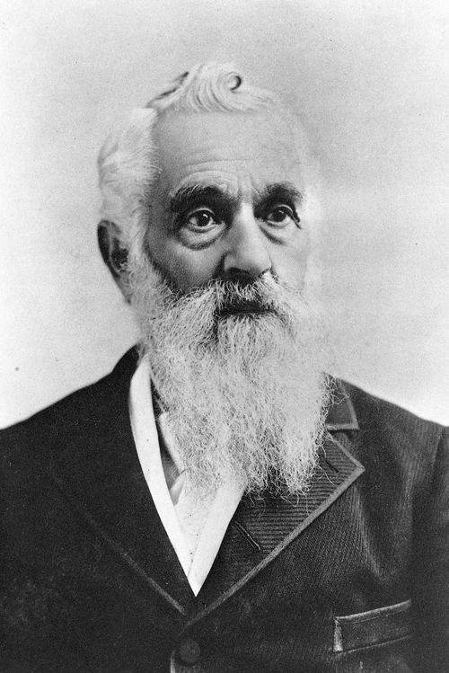 A portrait photograph of Lorenzo Snow with a long white beard, wearing a dark suit.