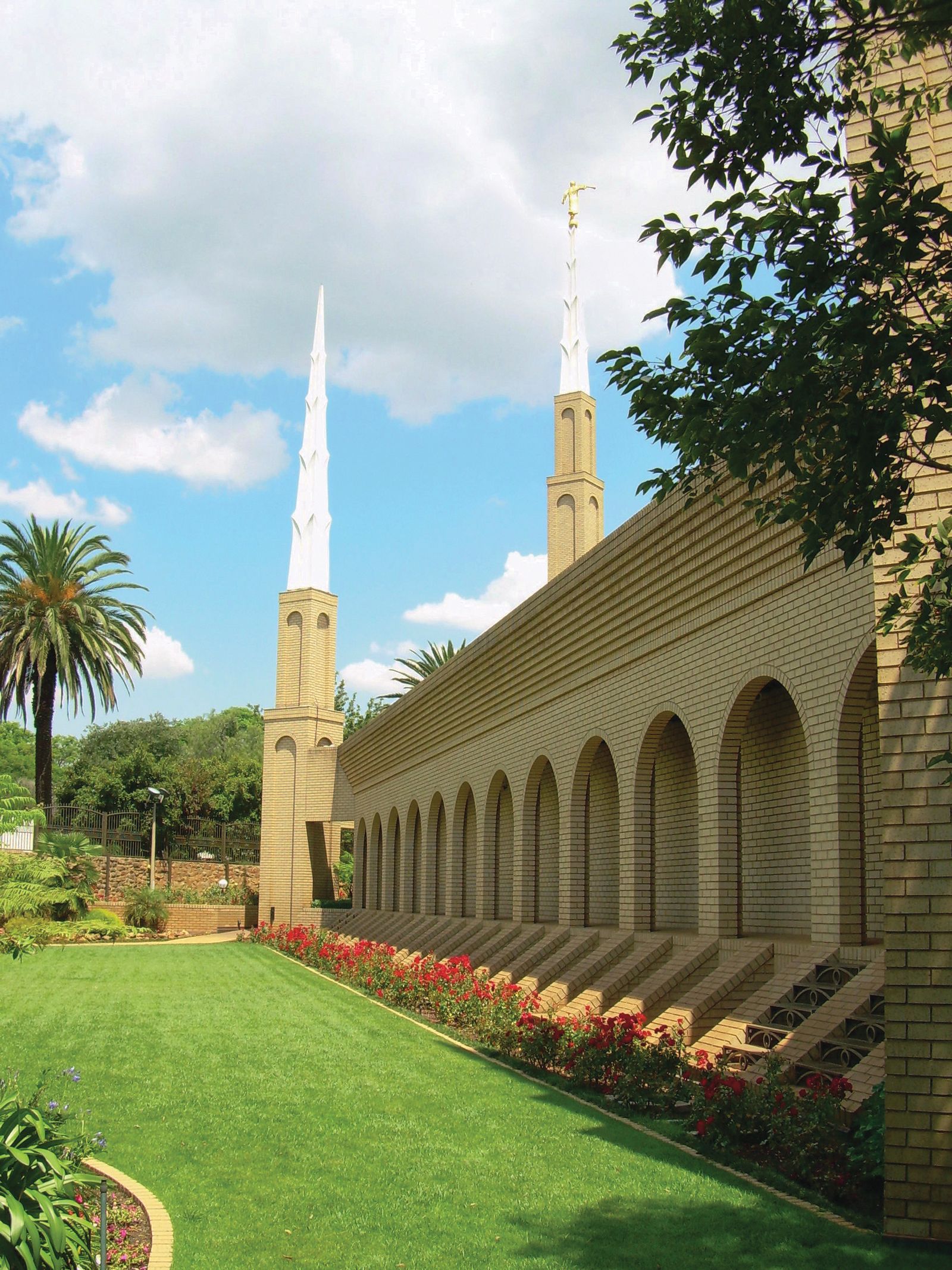 The Johannesburg South Africa Temple side view, including spires and scenery.