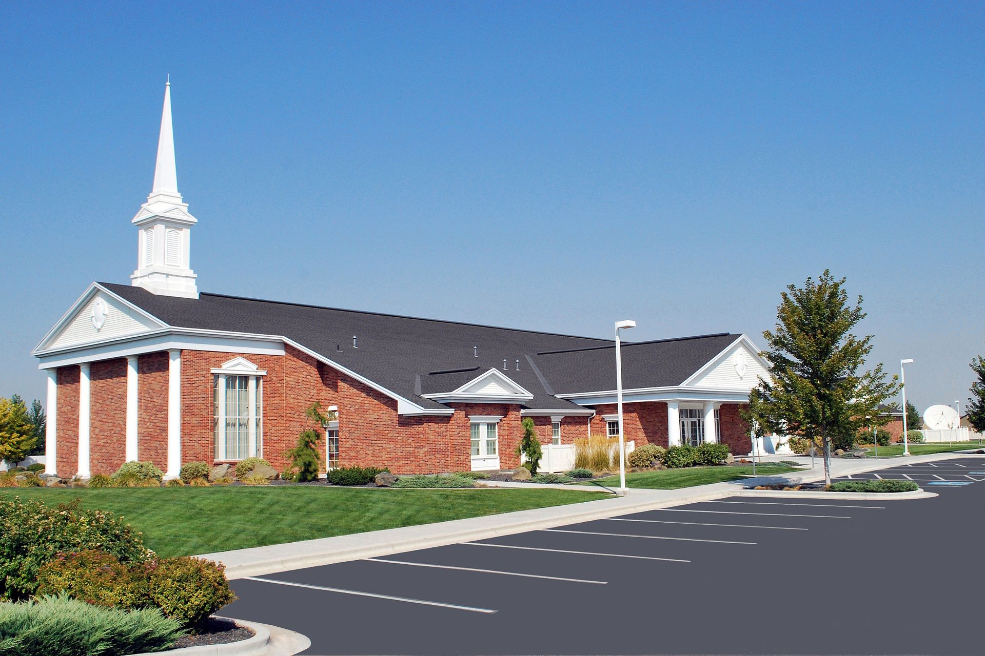 A side view of a chapel and parking lot in Caldwell, Idaho.