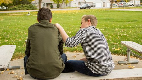 young men talking