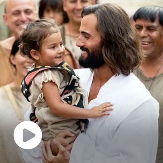 Jesus Christ tells the people to bring their little children. He hugs a child during His ministry in the Americas.