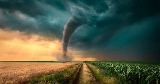 tornado traveling through field