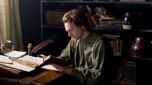 Joseph Smith reading and translating the Bible