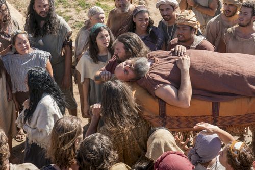 The Nephites carry Sherem after he is struck down as a sign from God.