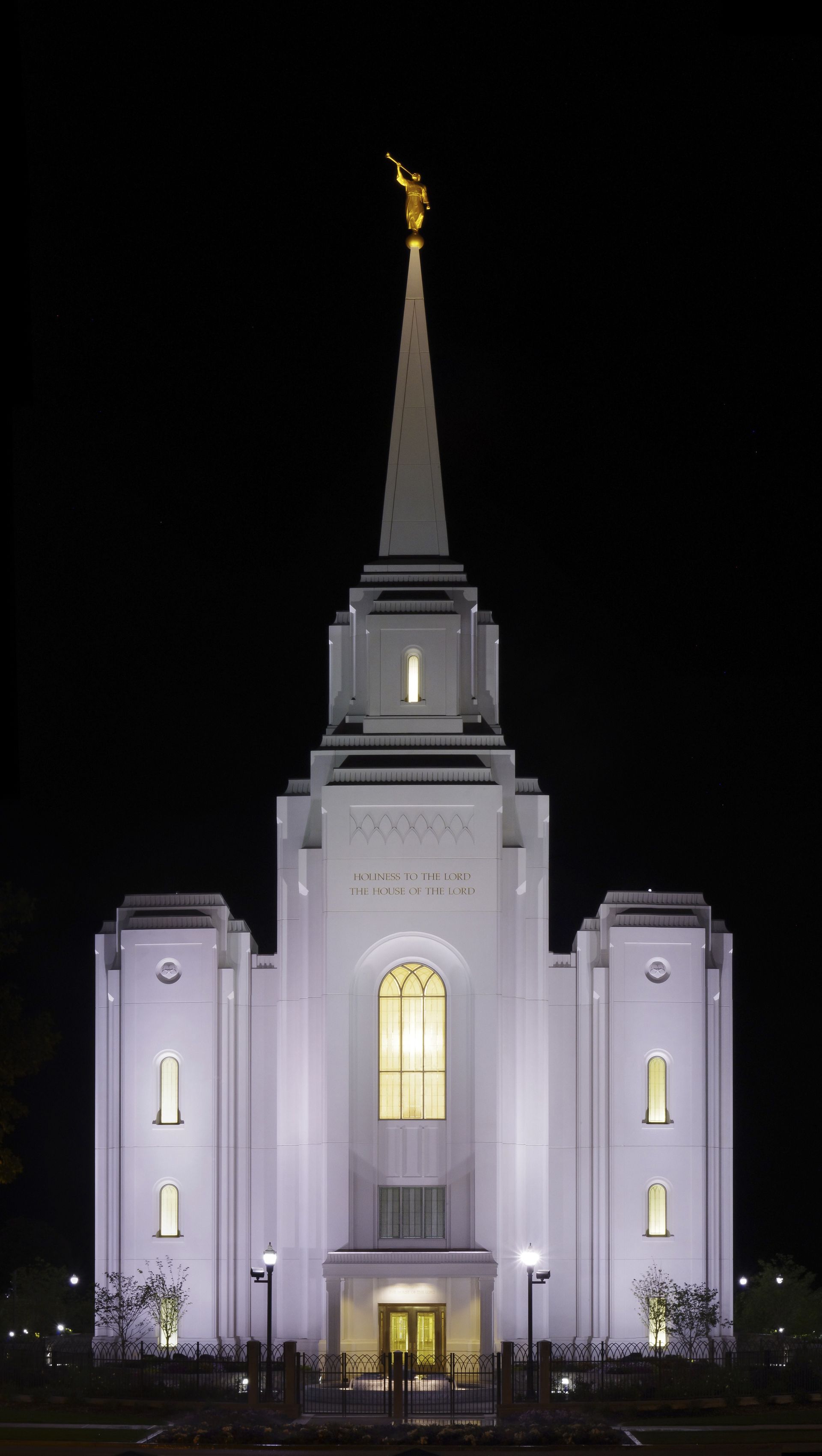 The Brigham City Utah Temple lit up in the evening.