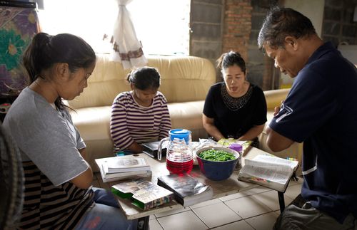 Family praying together