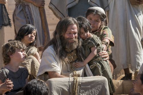 Jacob hugs a child as he teaches the Nephites.