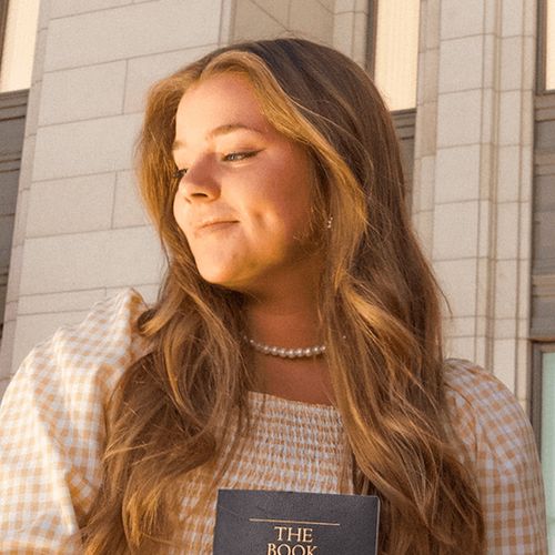 young woman with Book of Mormon