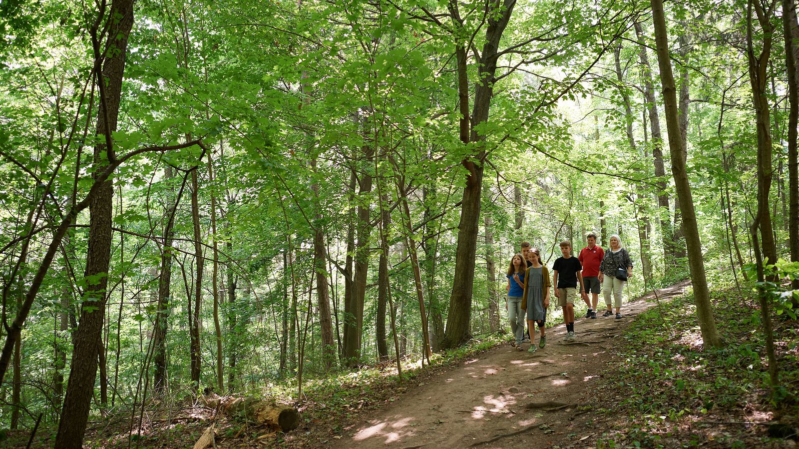 Various family members walk and hike on pathways leading to the Hill Cumorah in Manchester, New York.