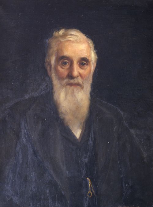 An oil painting of the prophet Lorenzo Snow with a long beard, wearing a black suit and a watch chain.