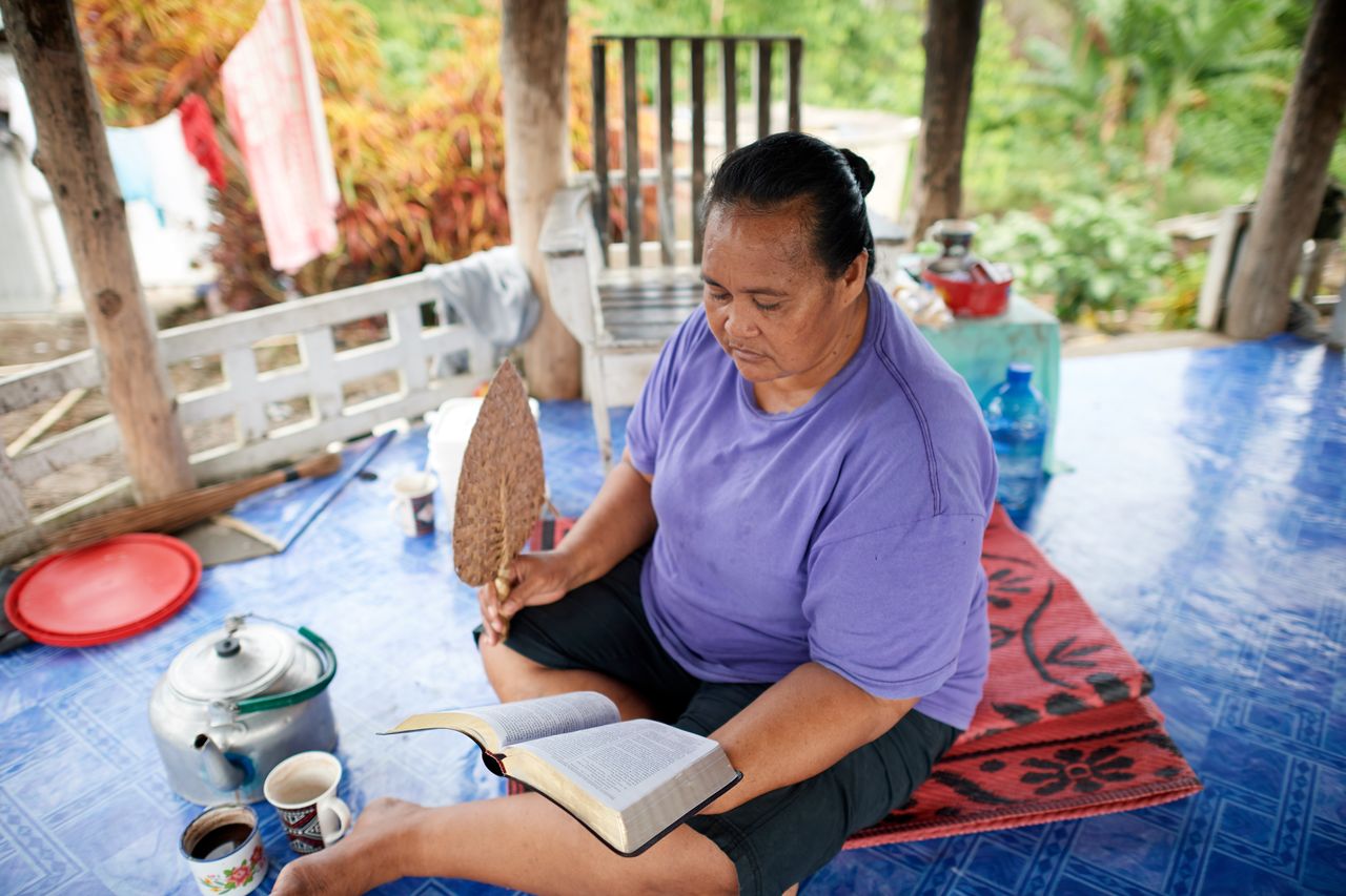 A woman reading the Book of Mormon