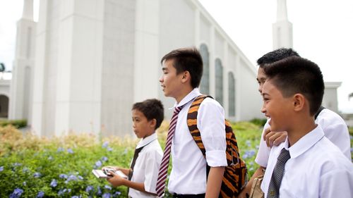 young men outside temple