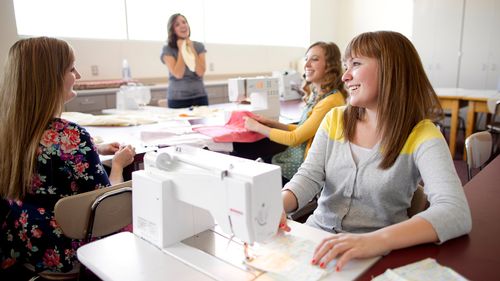 young women sewing