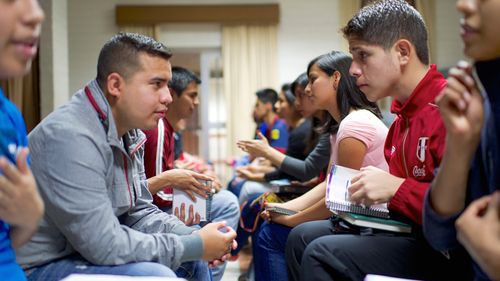 young men and women talking