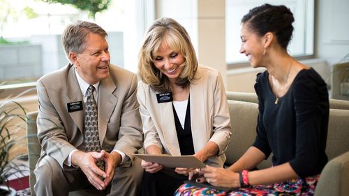 missionary couple teaching woman