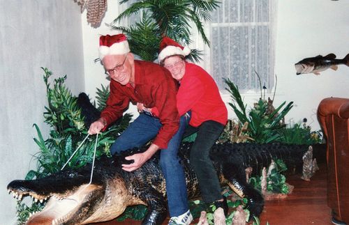 couple riding an alligator