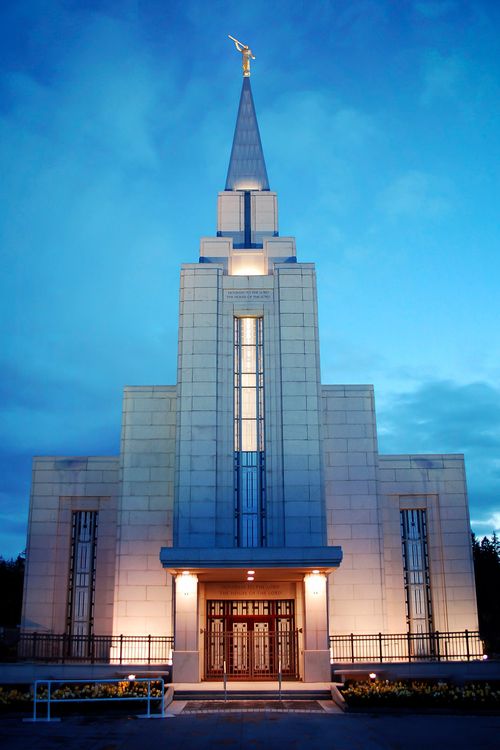 The front entrance to the Vancouver British Columbia Temple, lit up at night.