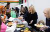 President Camille N. Johnson serving food at event