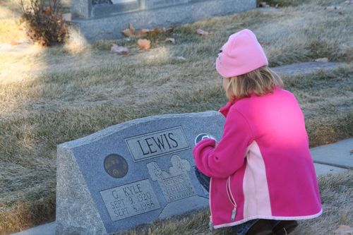 Young girl at a grave.