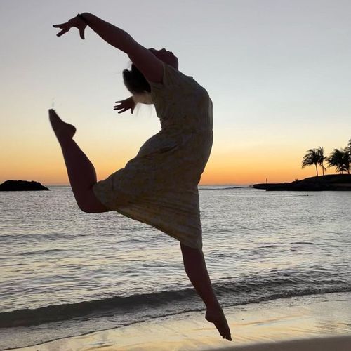 silhouette of woman on beach