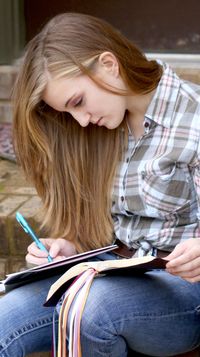 young woman writing