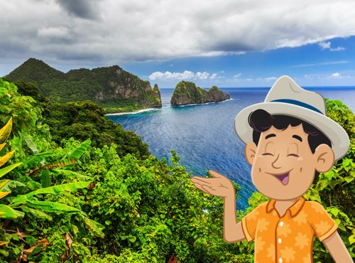 Paolo pointing at beautiful green hills and ocean