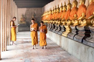 boys reading sacred Buddhist religious text