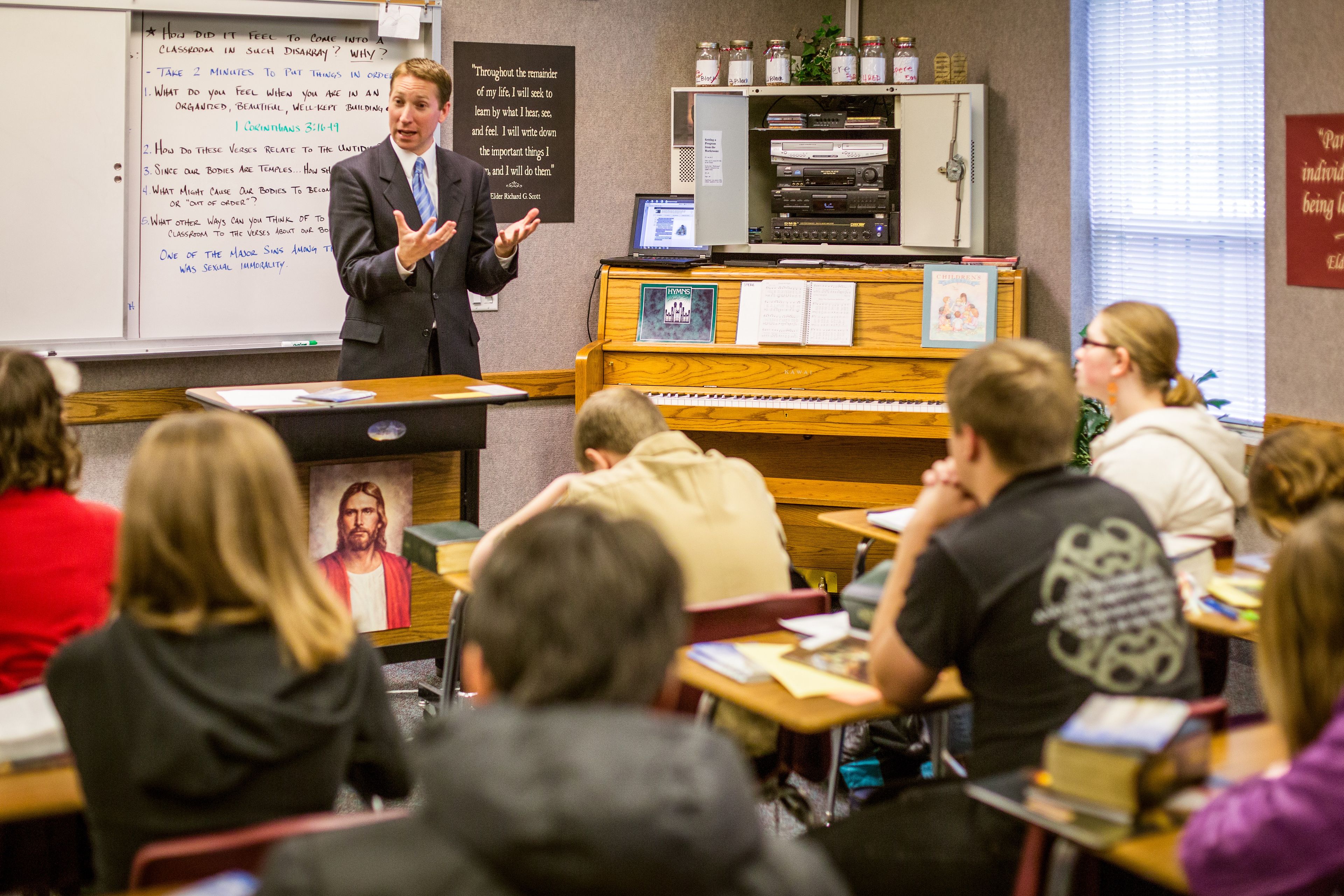 Seminary teacher teaching high school students.