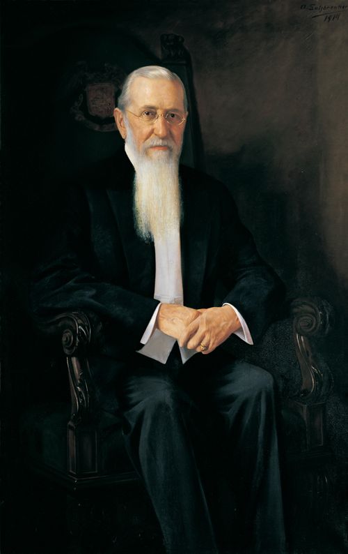 A painted portrait of Joseph F. Smith sitting in a large black chair, by A. Salzbrenner.