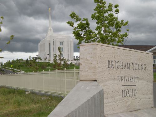 The entire Rexburg Idaho Temple, with the surrounding grounds and the Brigham Young University–Idaho name sign in the foreground.