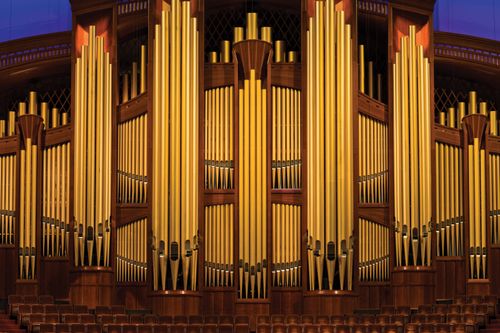 An image of the organ pipes behind the choir seats inside the Conference Center.