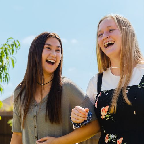 two girls locking arms