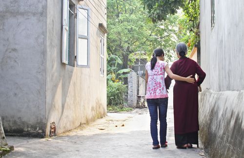 walking with an elderly woman