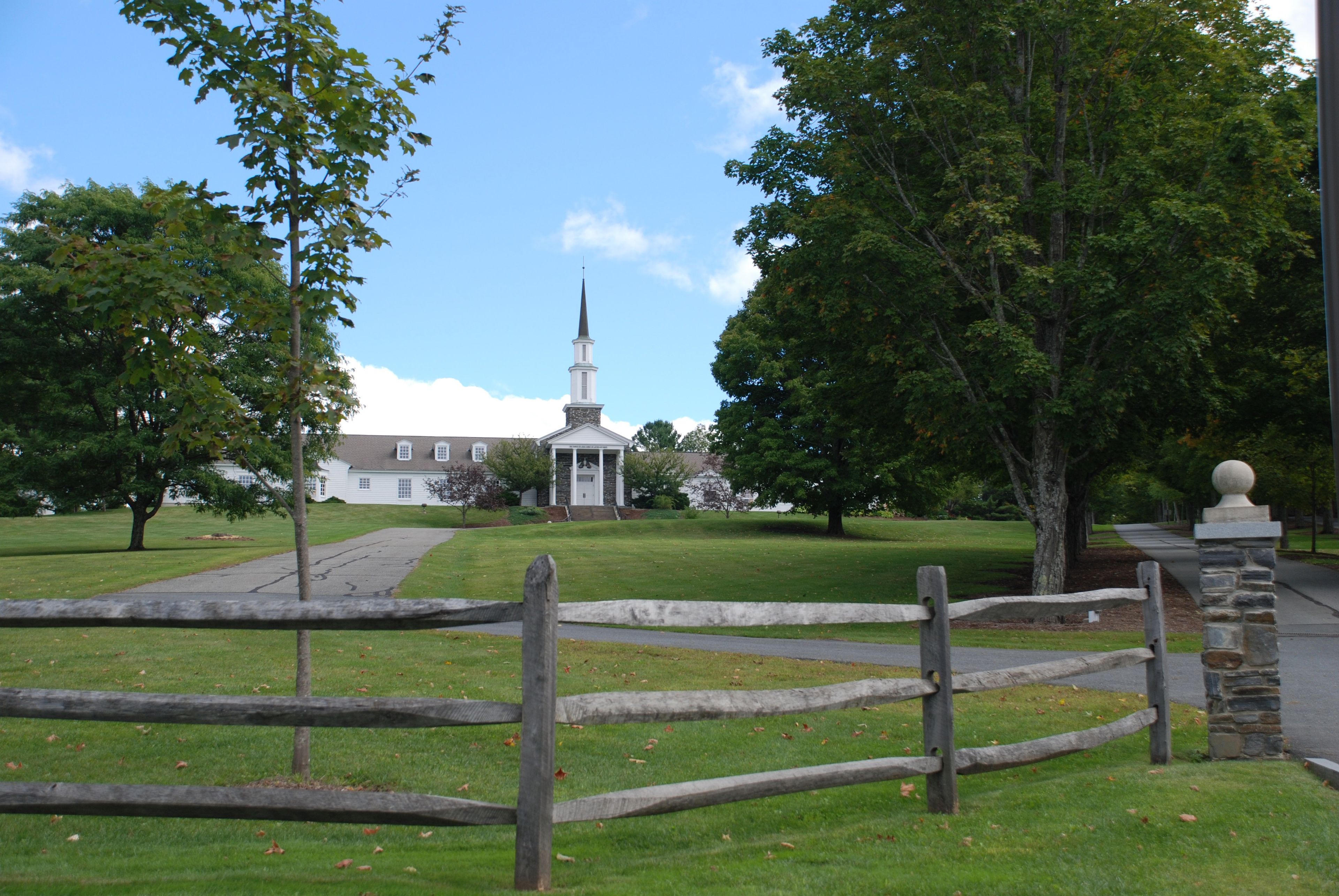 A historic meetinghouse in Sharon, Vermont, shown in the distance.