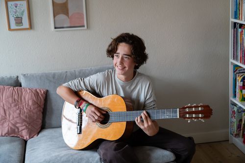 young man playing guitar