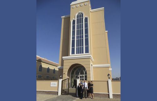 family in front of stake center