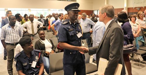 Elder David A. Bednar greeting chaplain general of Ghana police