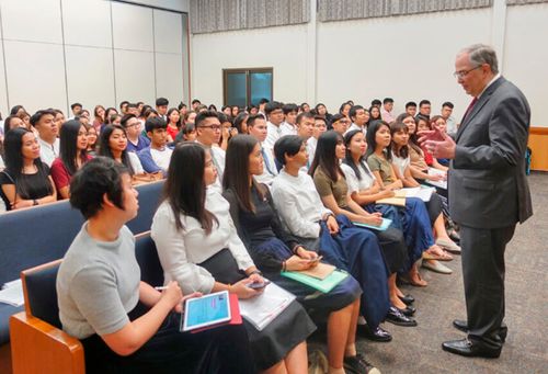 Elder Andersen speaking to missionaries